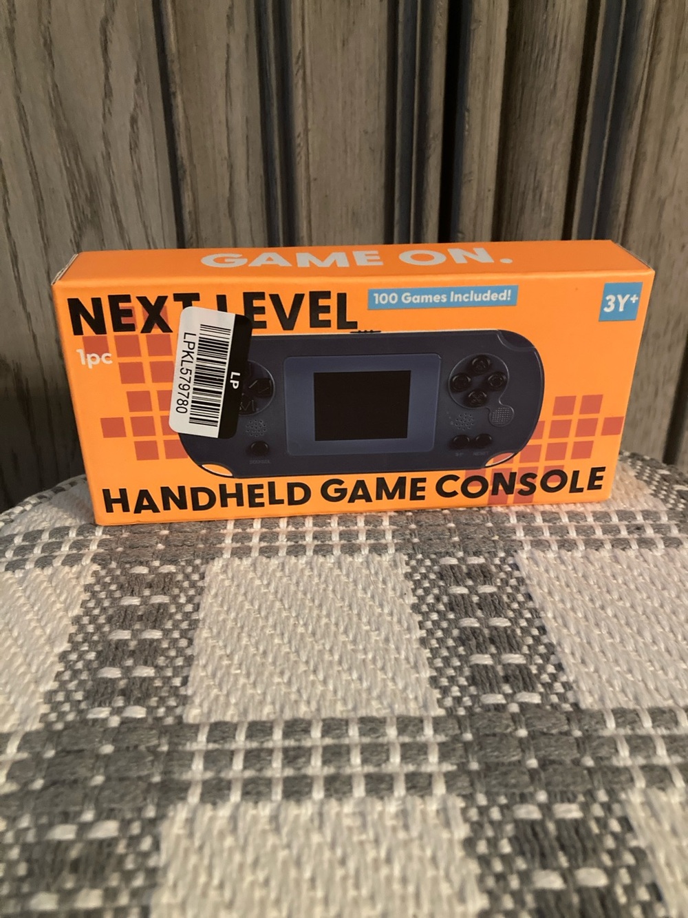 Next Level Apparel Handheld Game Console - Orange Box, Blue Device